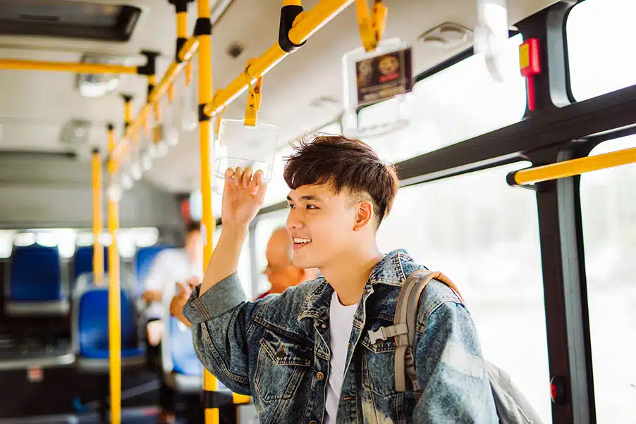 Asian man taking public transport