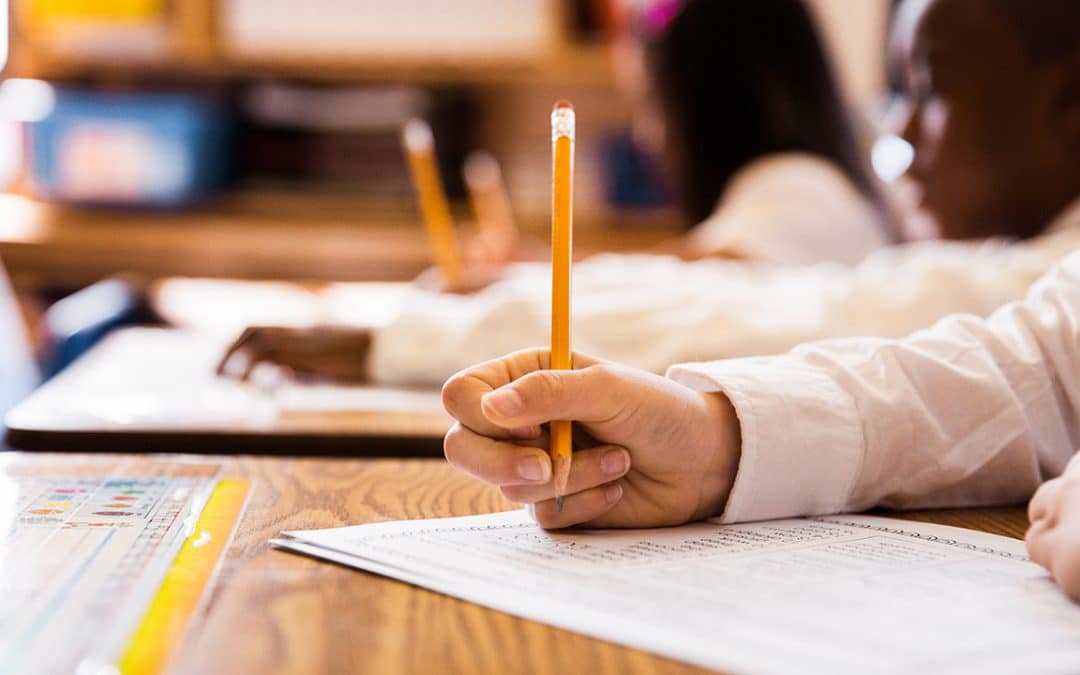 students in classroom taking test