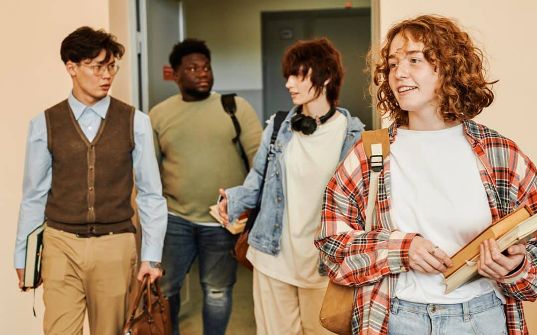 students walking in college classroom