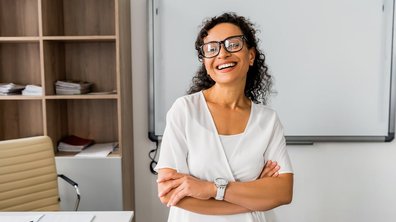 teacher in classroom with whiteboard