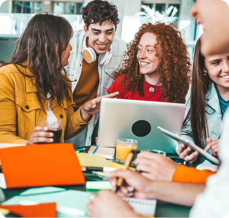 Counselor with students at table