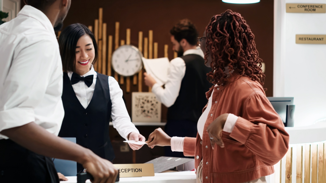women checking in at hotel